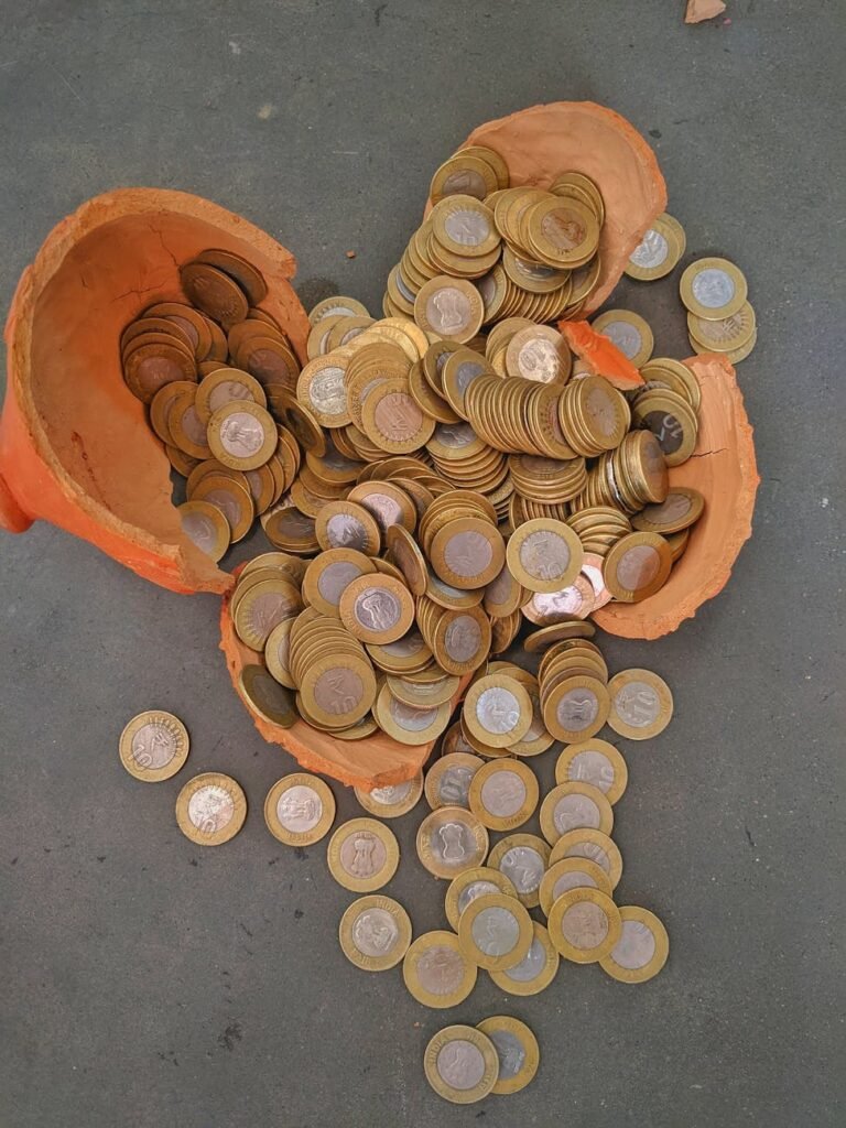rupee coins in a broken piggy bank